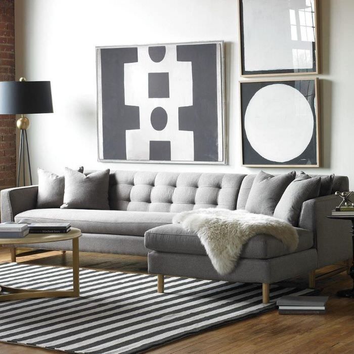 Строгость, стиль и уют: серый диван в интерьере